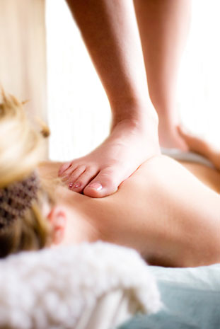 Masseuse walking on back