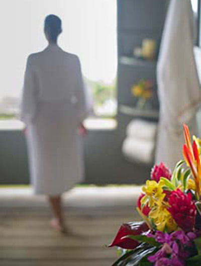 woman with flowers in foreground